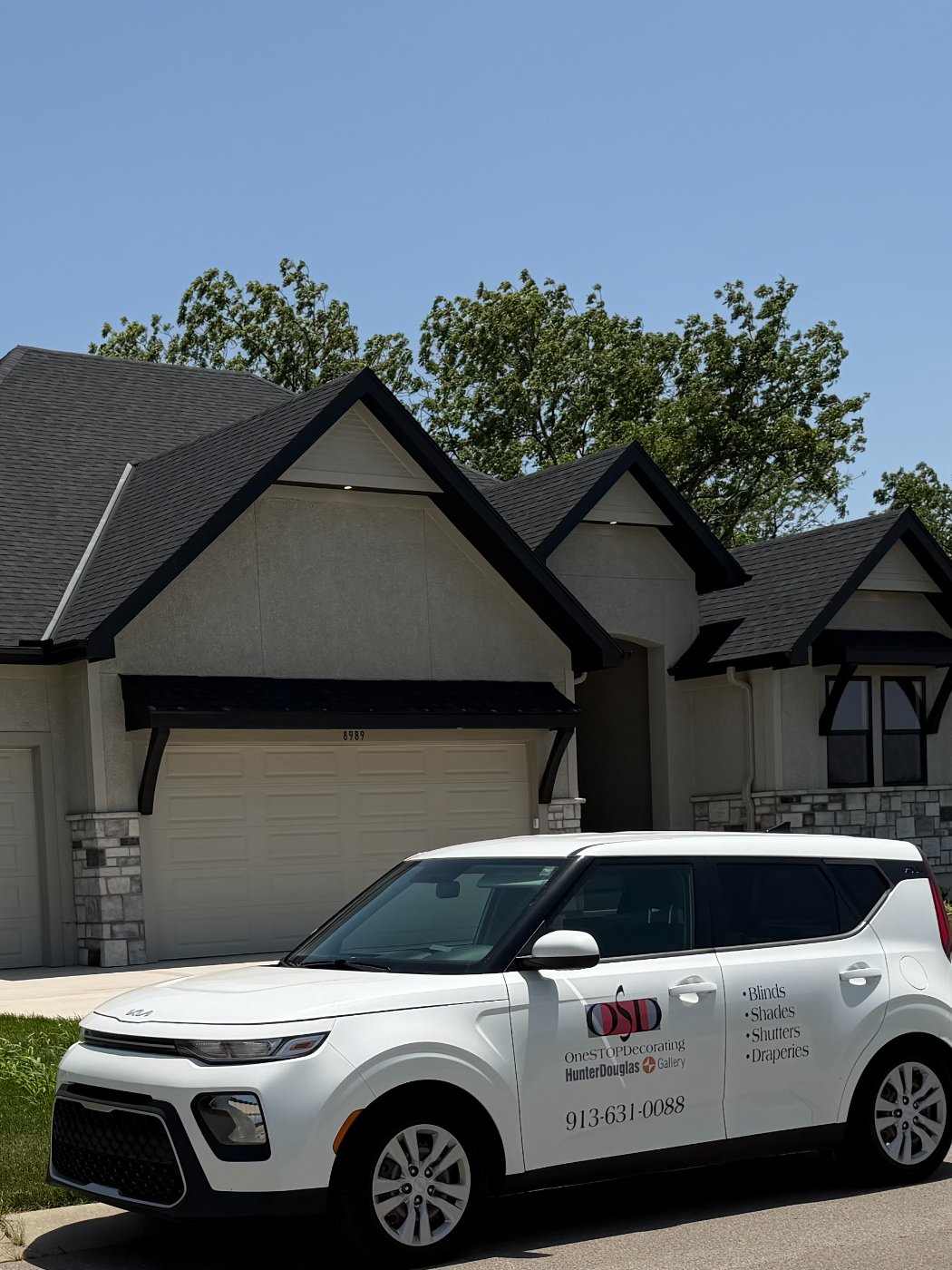 One Stop Decorating branded vehicle parked in front of a Kansas City home for an in-home consultation