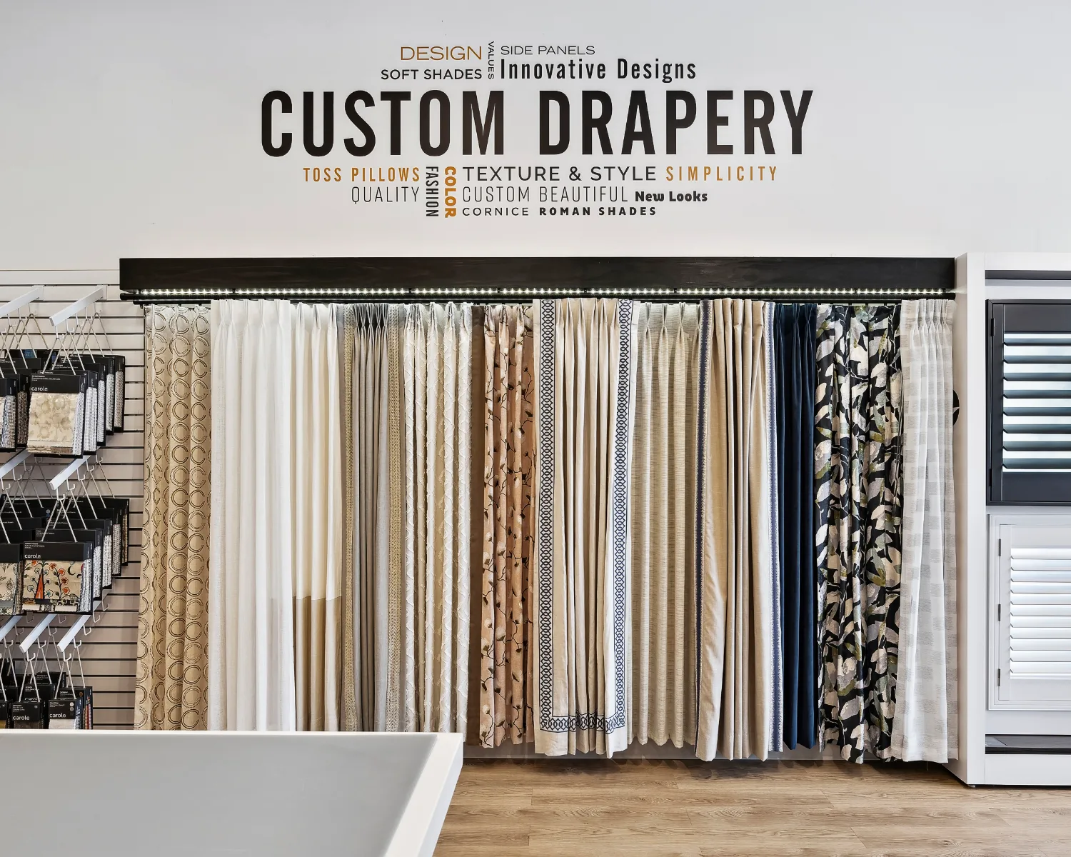 Custom drapery panels and fabric samples on display